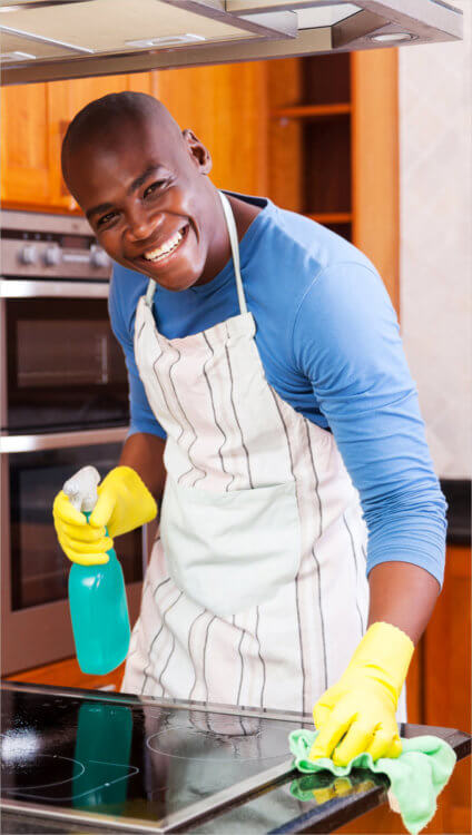 black guy cleaning the induction stove